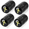 Set of four black metal tire valve stem caps with yellow cross inserts