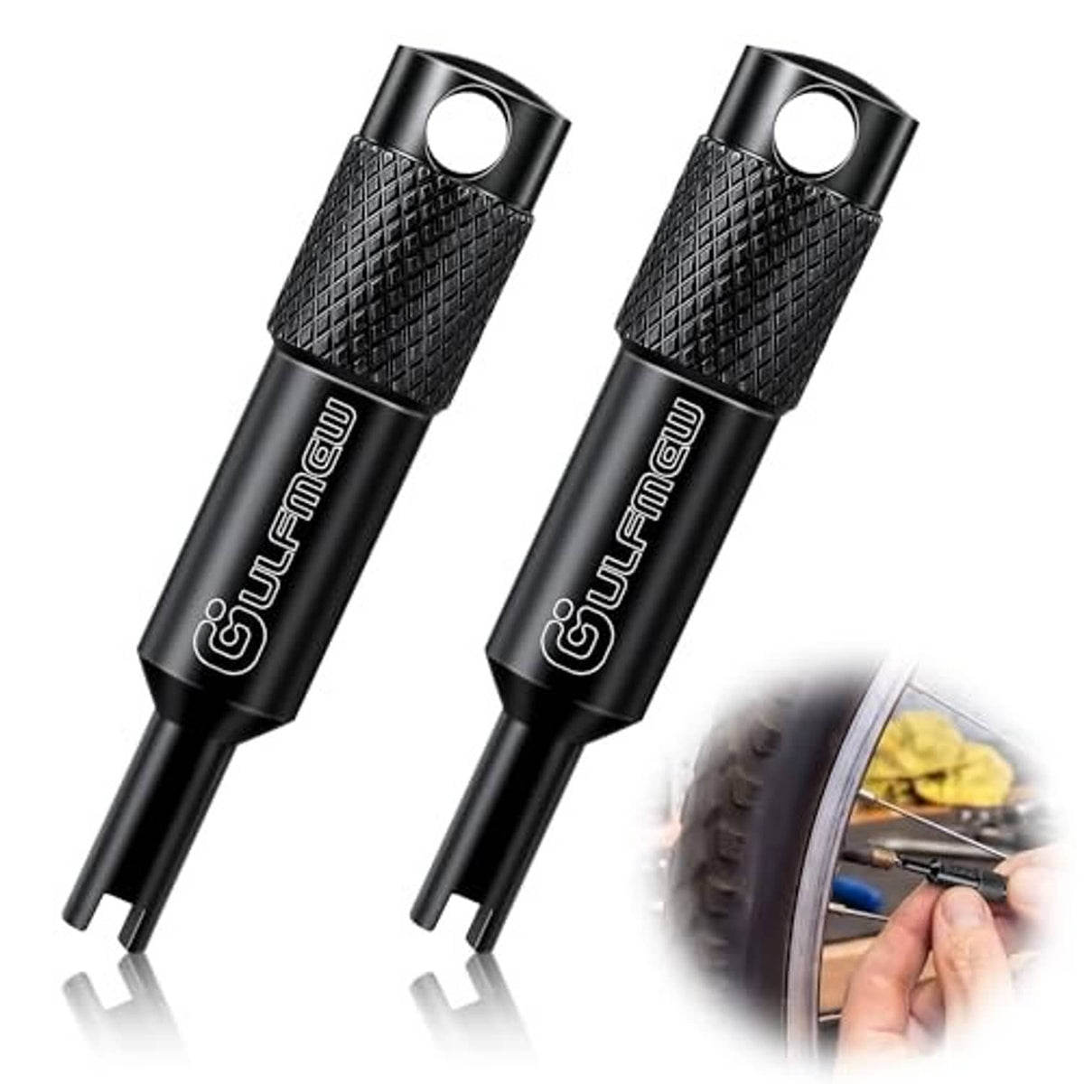 Two black valve core removal tools with textured grip and loop hole, angled view