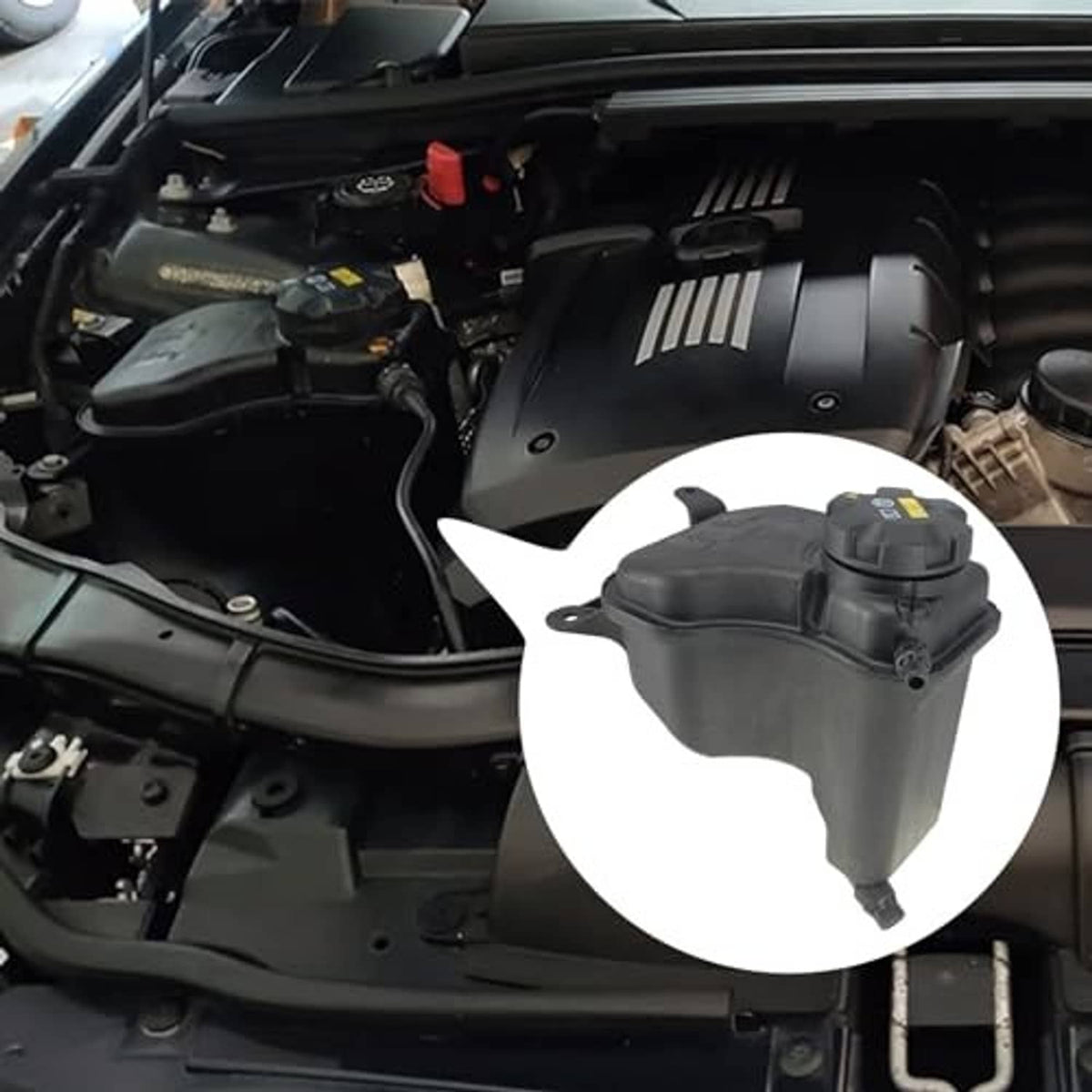 Engine coolant reservoir tank installed in engine bay, black plastic with sensor cap