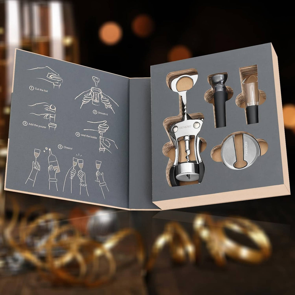Wine accessories gift box open with silver tools and circular stopper rings