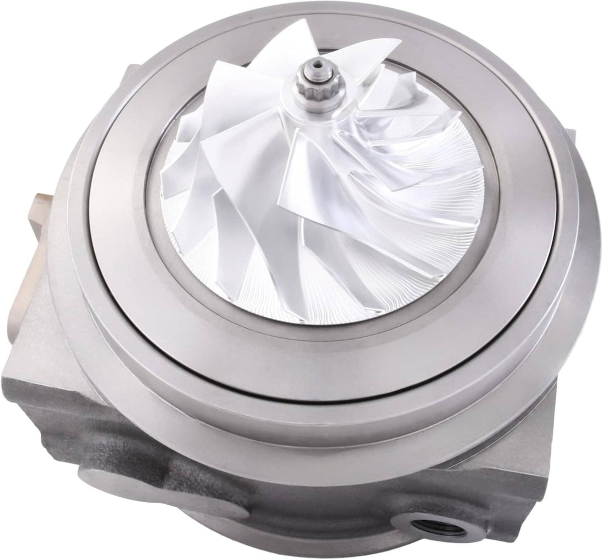 Turbo cartridge turbocharger, front view with silver turbine wheel and circular housing