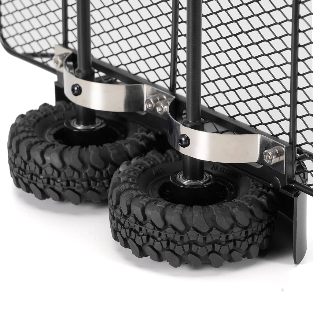 Black metal trailer frame with rubber tires and silver wheel brackets