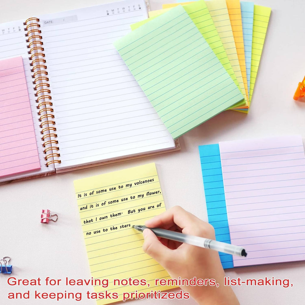 Colorful 4x6 lined sticky notes with a hand writing with a pen