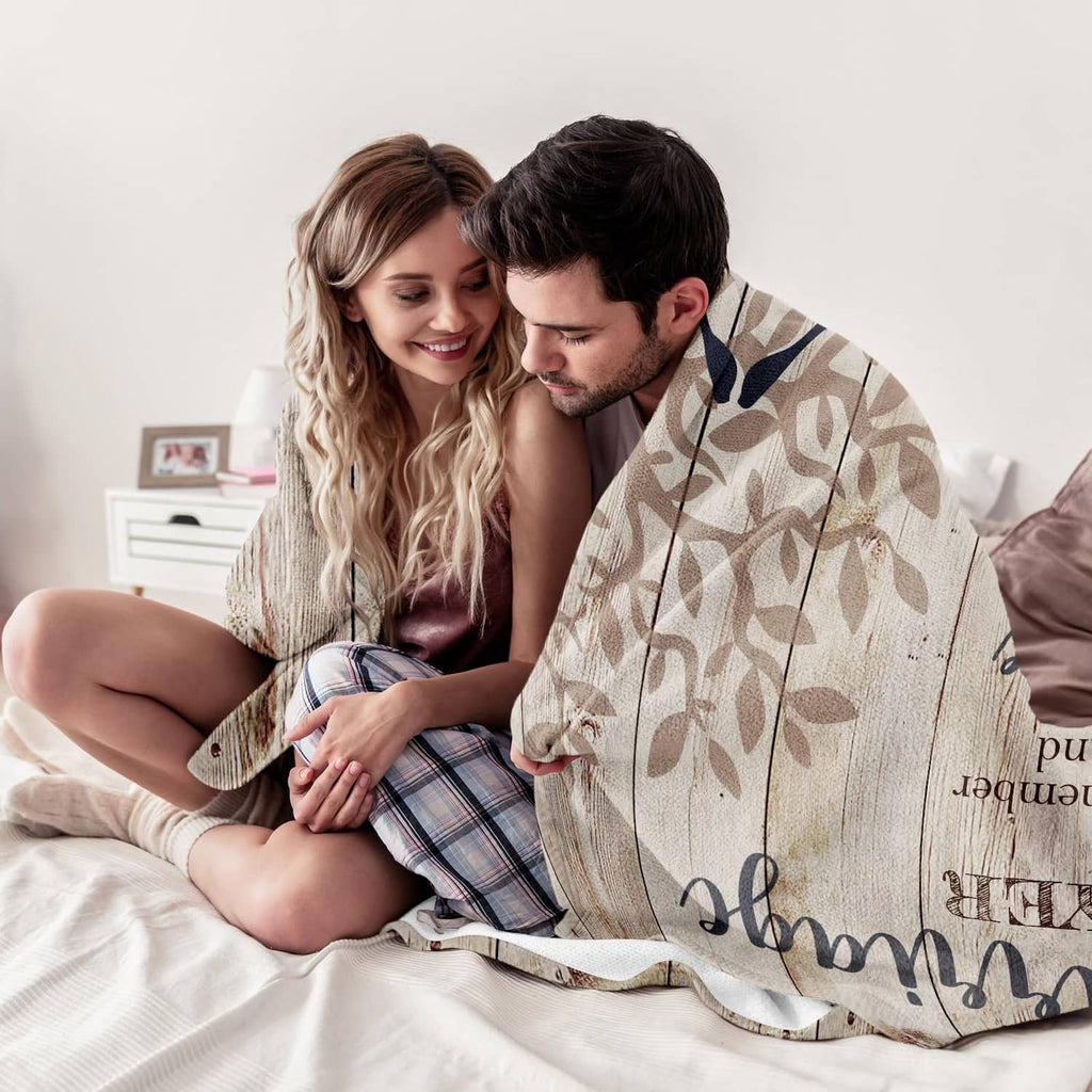 Beige marriage prayer throw blanket close-up with leafy pattern and printed couple hugging