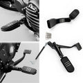 Black mid forward motorcycle footpeg levers with matching hardware and spring accents