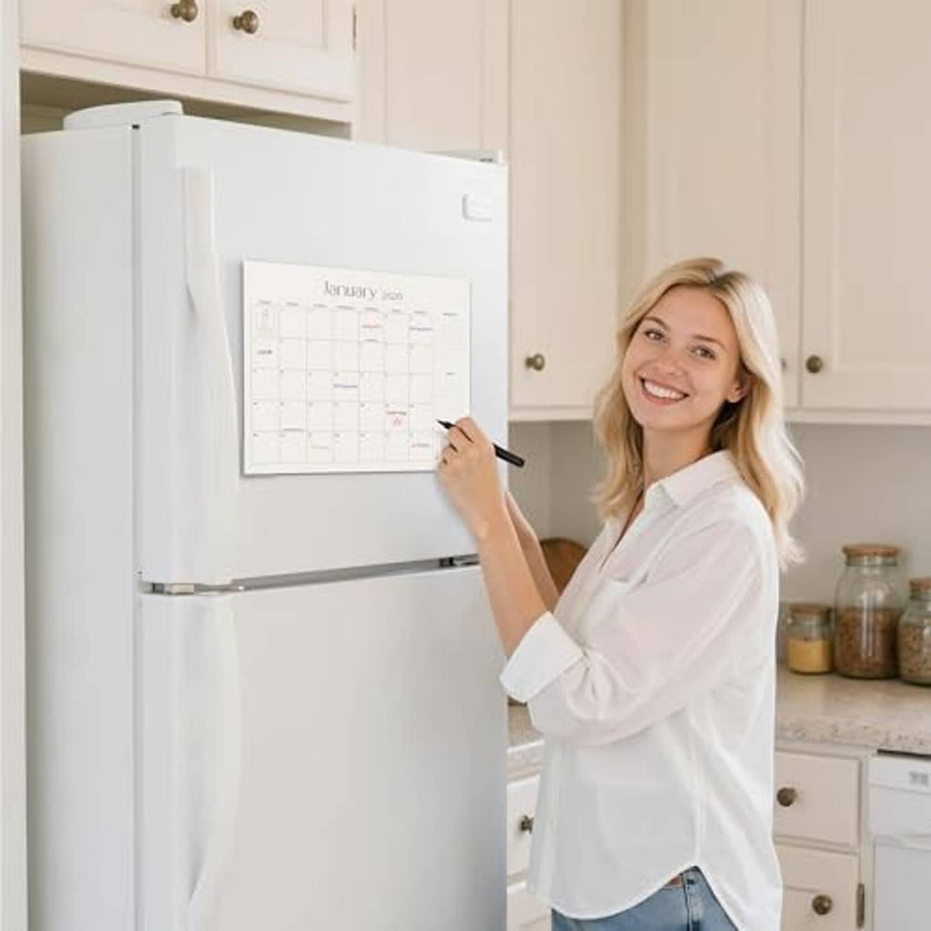 Refrigerator magnetic calendar on white fridge, with January 2026 grid highlighted