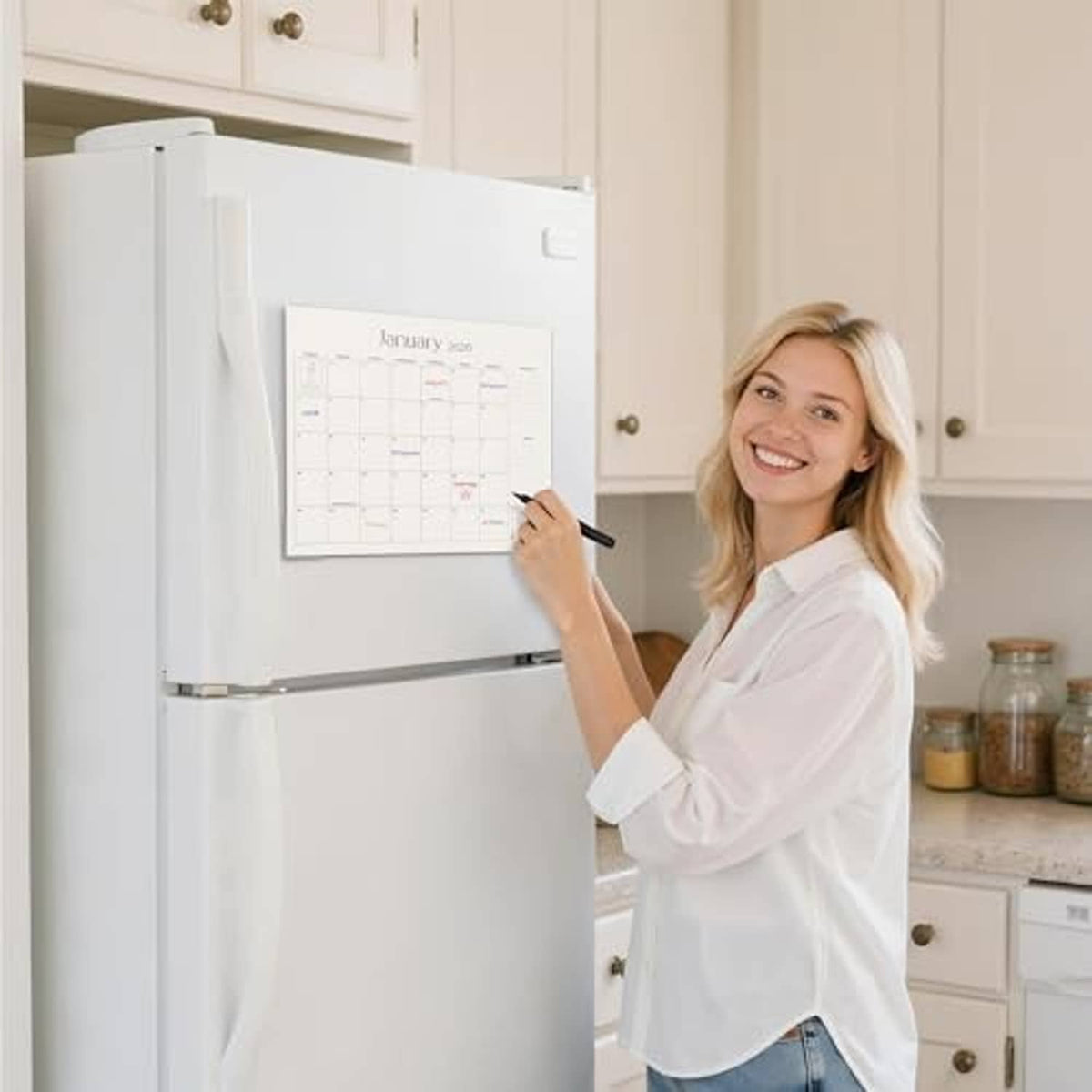Refrigerator magnetic calendar on white fridge, with January 2026 grid highlighted