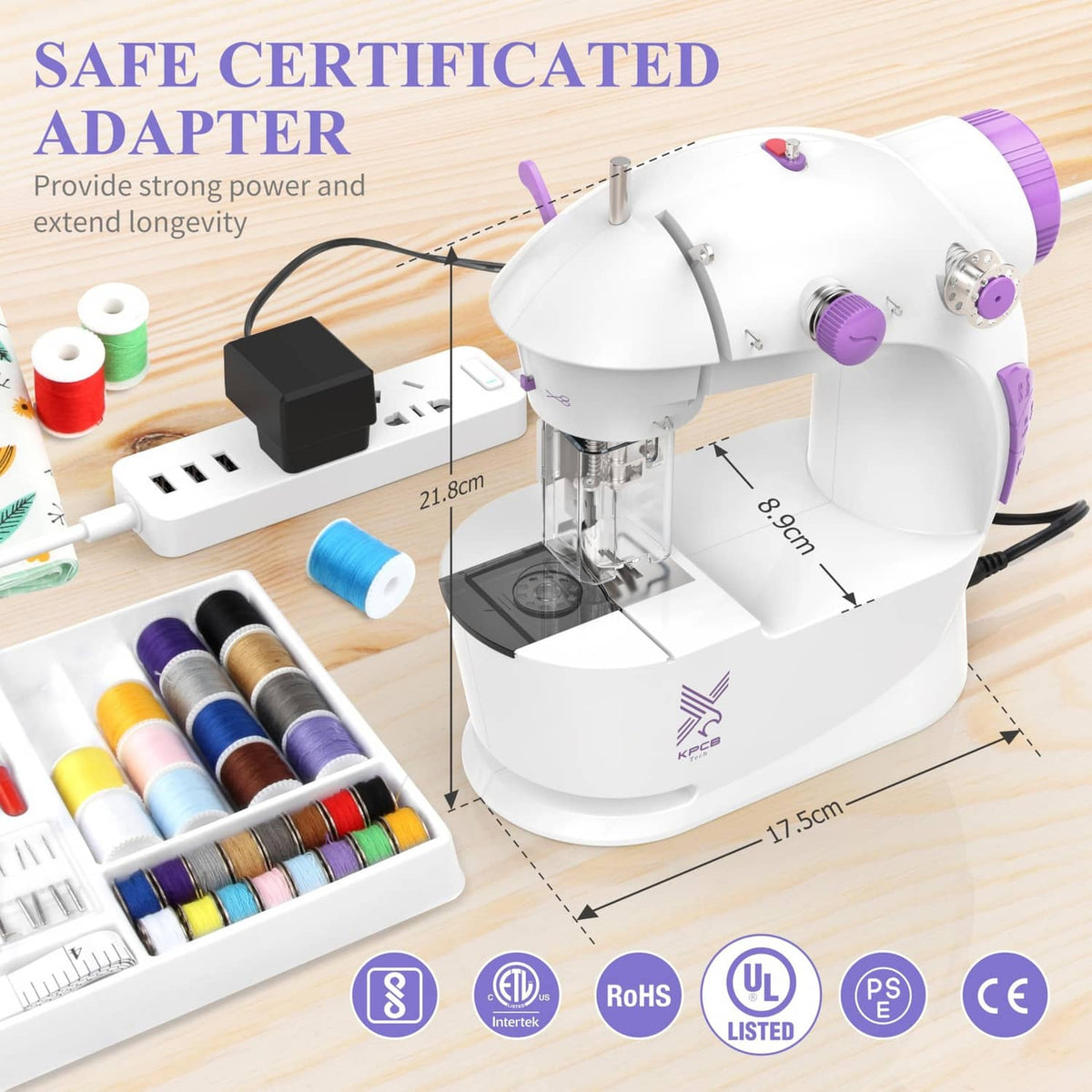 White sewing machine with included power adapter and sewing guide setup