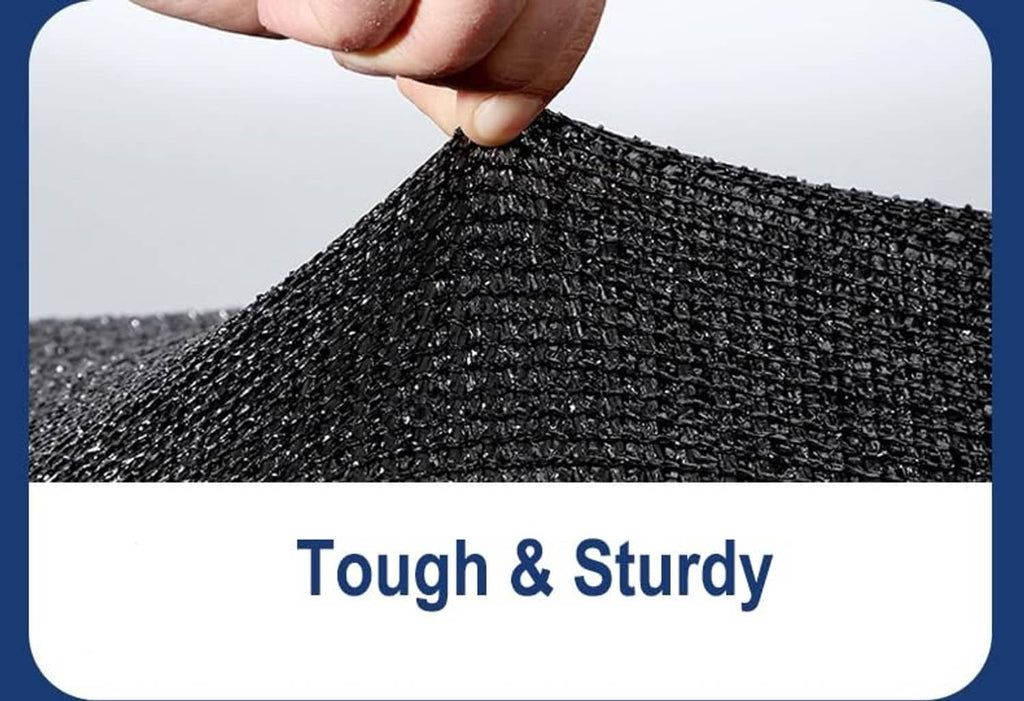 Hand holding dark woven shade cloth mesh with reinforced binding edge