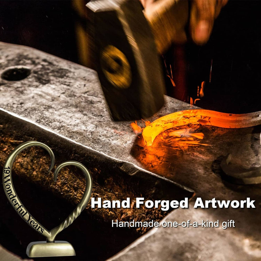 Bronze heart anniversary sculpture with visible hand-forged craftsmanship details