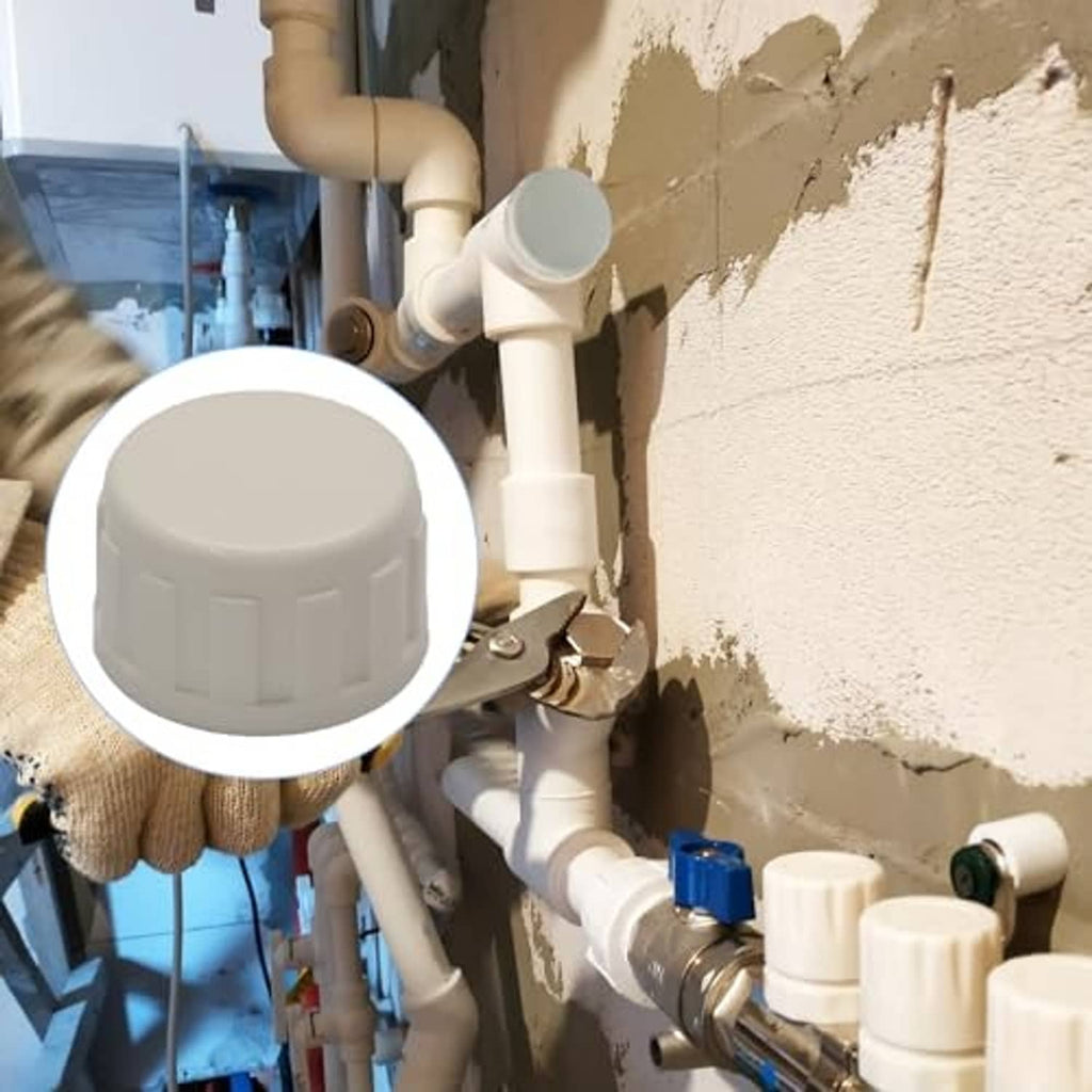 PVC sprinkler pipe cap, white end cap in outdoor sprinkler plumbing setup