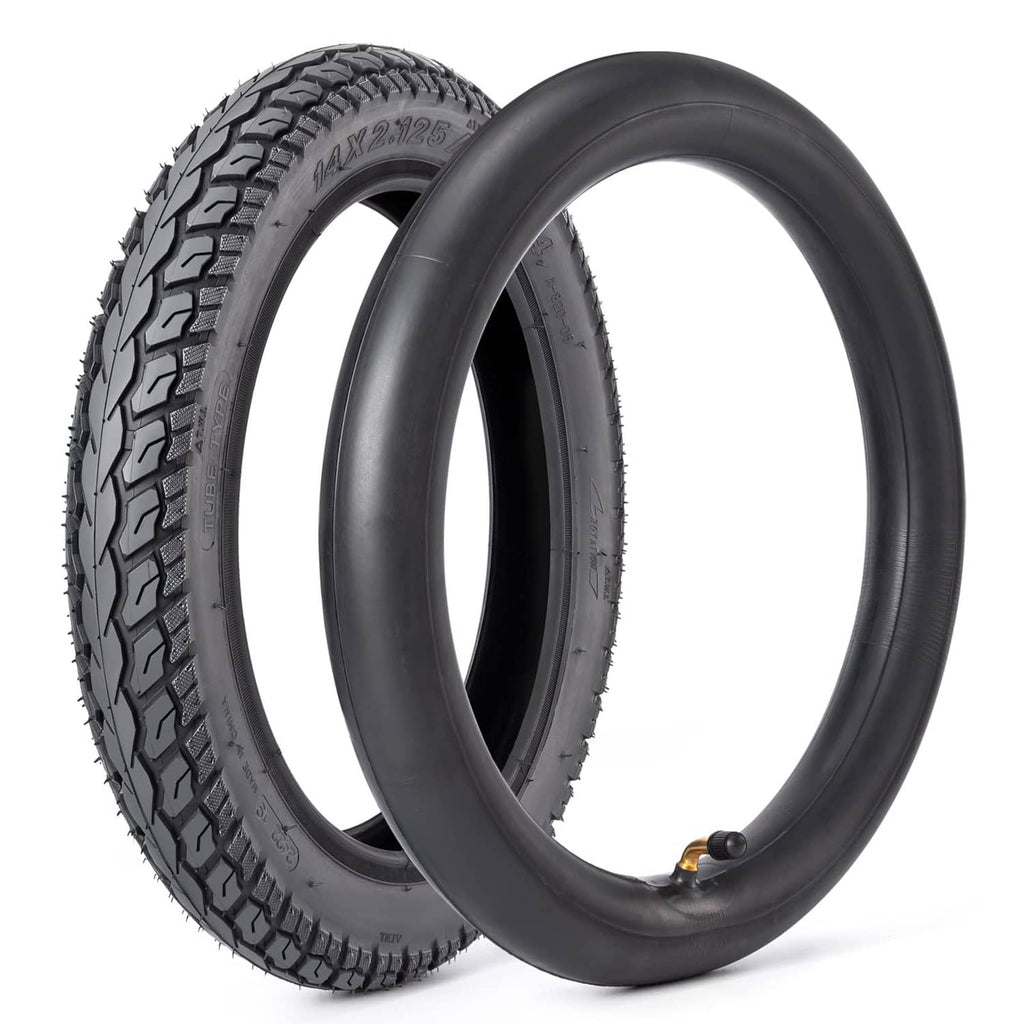 Black 14-inch tire and tube set with angled valve stem and deep tread pattern.