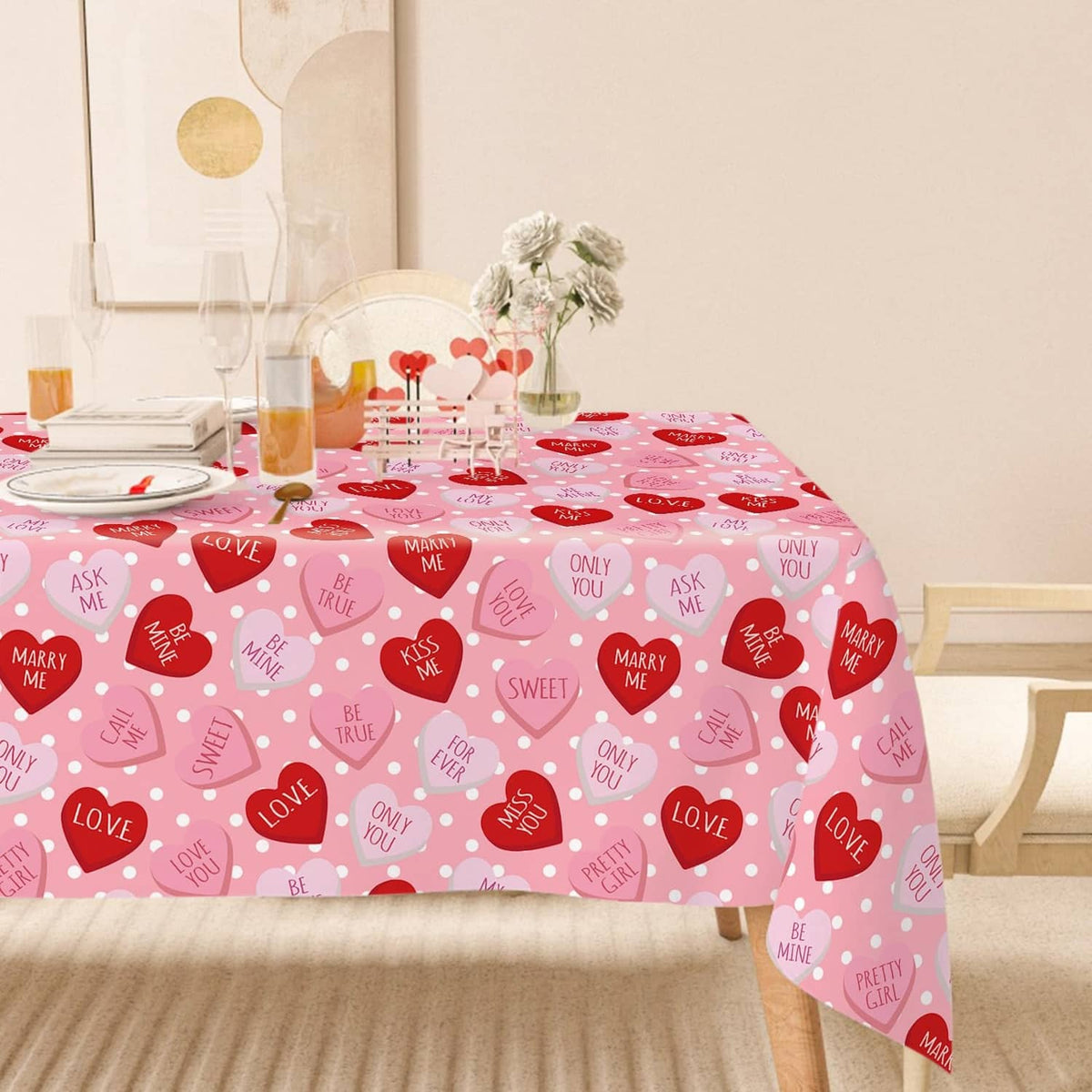 Pink rectangular tablecloth with repeating hearts and love-message icons across the surface