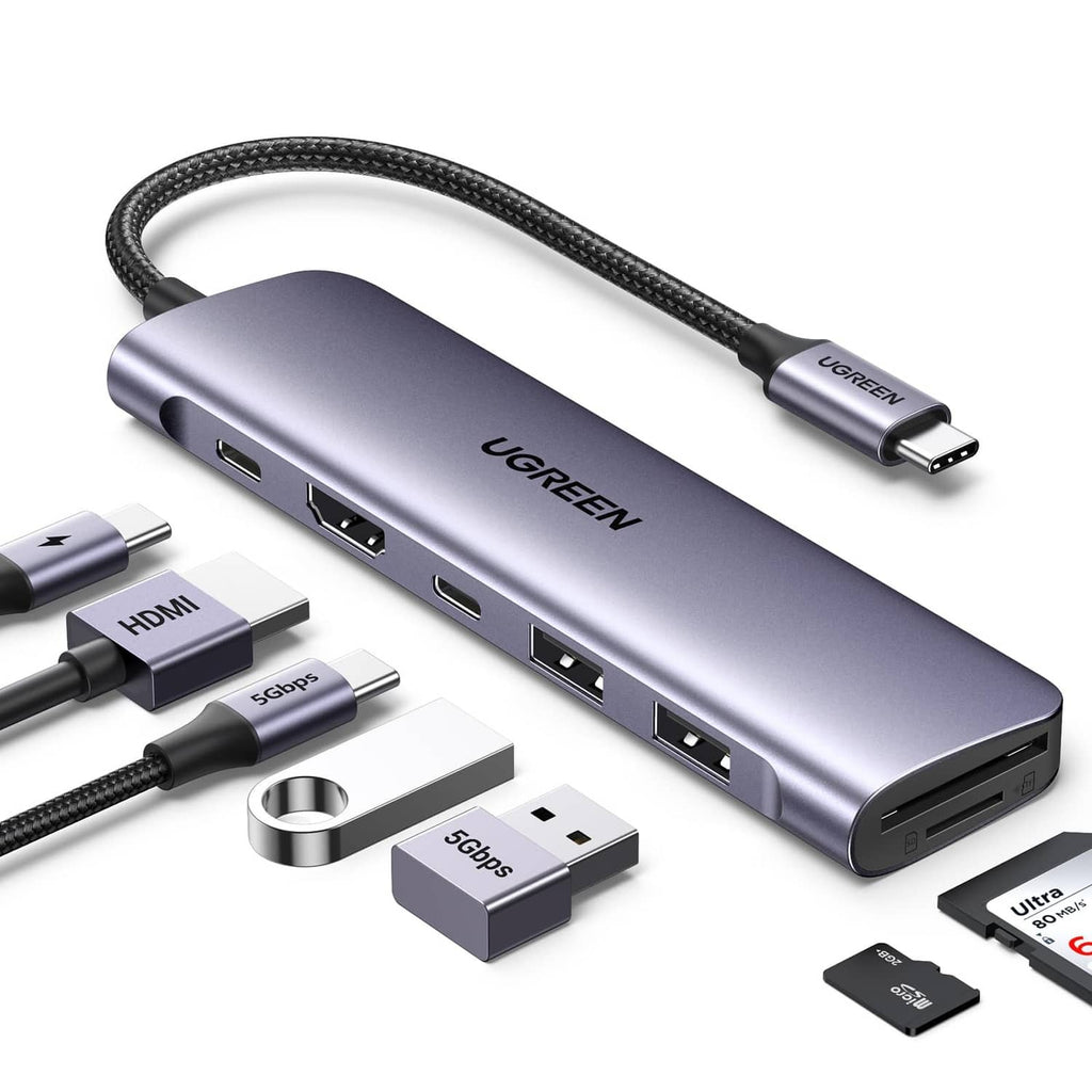 Space gray USB-C docking hub with braided cable, HDMI, USB ports, and card slot