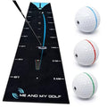 Black putting mat with center blue break line and three practice golf balls