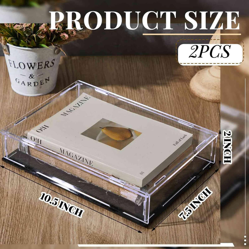 Clear acrylic book display case with black base holding a magazine