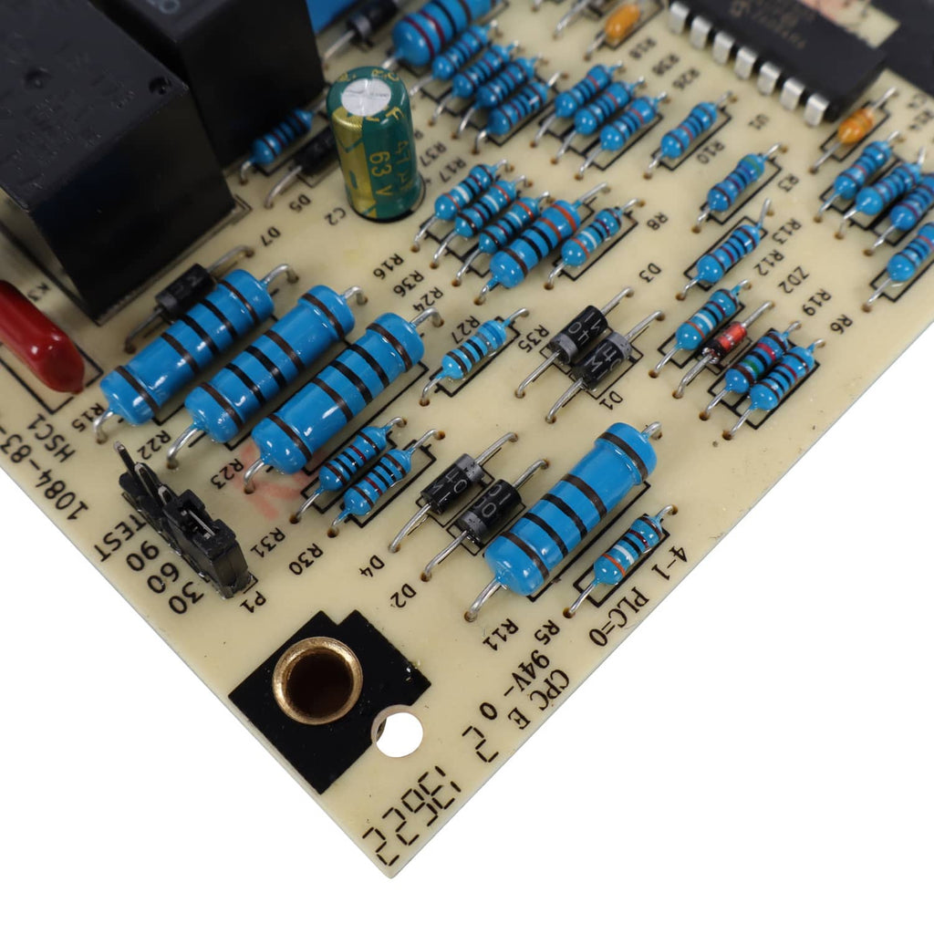 Control board PCB corner detail with blue capacitors and resistor network