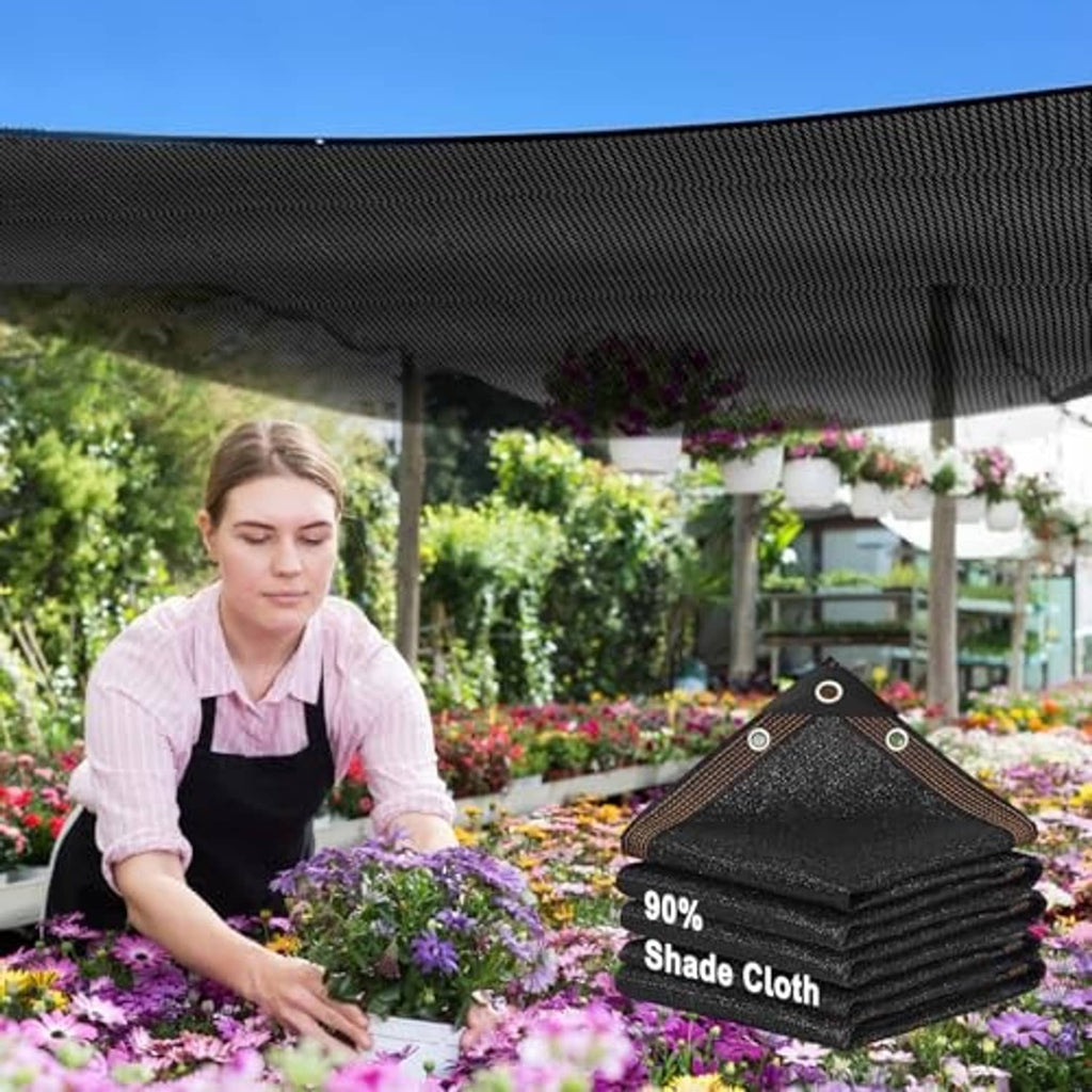 Black shade cloth sun shade net, folded with reinforced corner grommet tabs