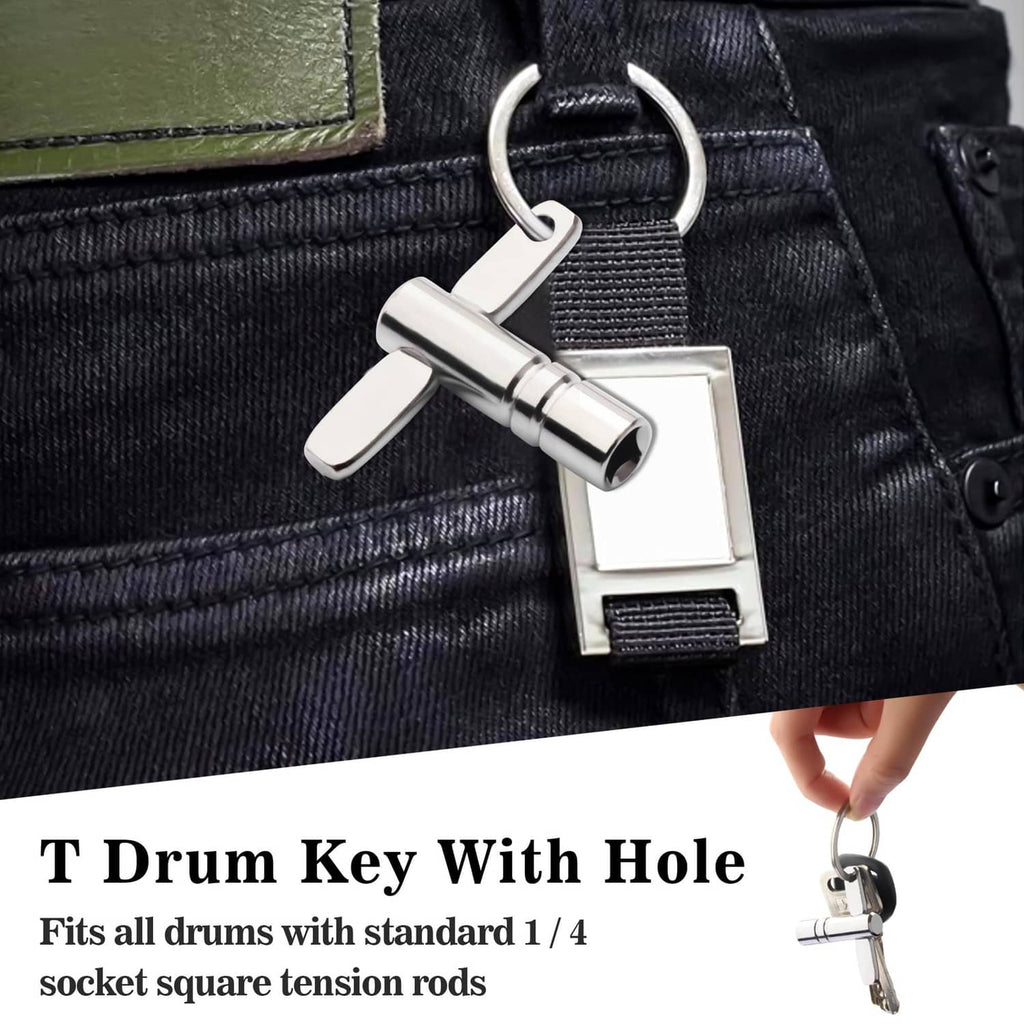Chrome drum tuning key clipped to a belt loop on dark jeans