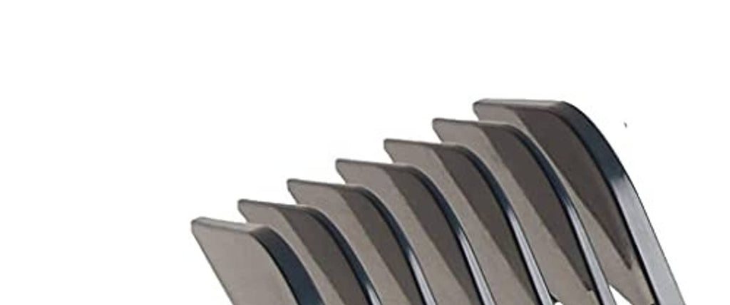 Close-up of hair clipper comb guard teeth on a dark attachment