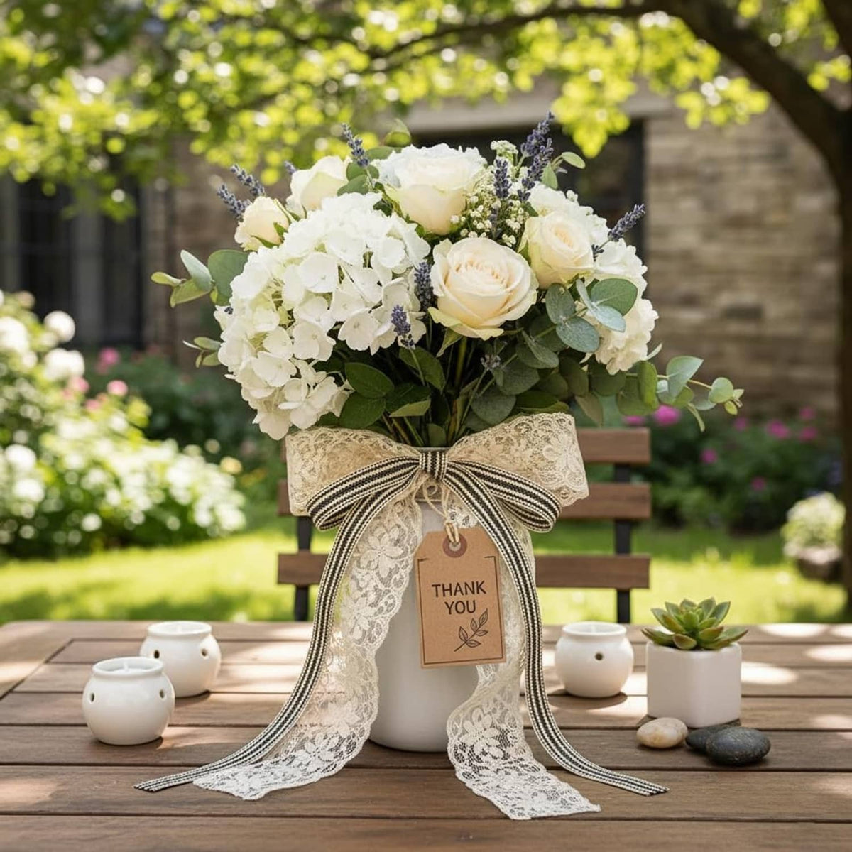 Ivory and black striped ribbon bow with trailing ends on a floral arrangement