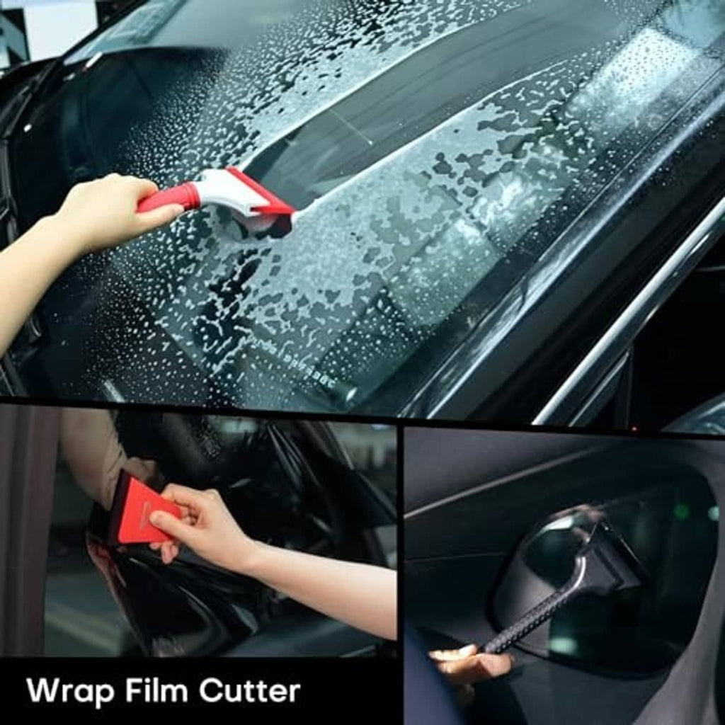 Wrap film cutter with red handle trimming windshield vinyl, hand holding tool