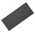 Black PVC garage floor mat with diamond plate texture, angled view