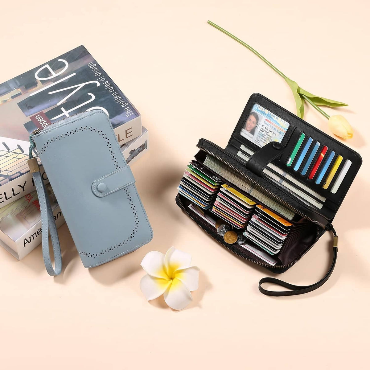 Black leather card wallet with ID window, colorful card slots, next to a blue wallet