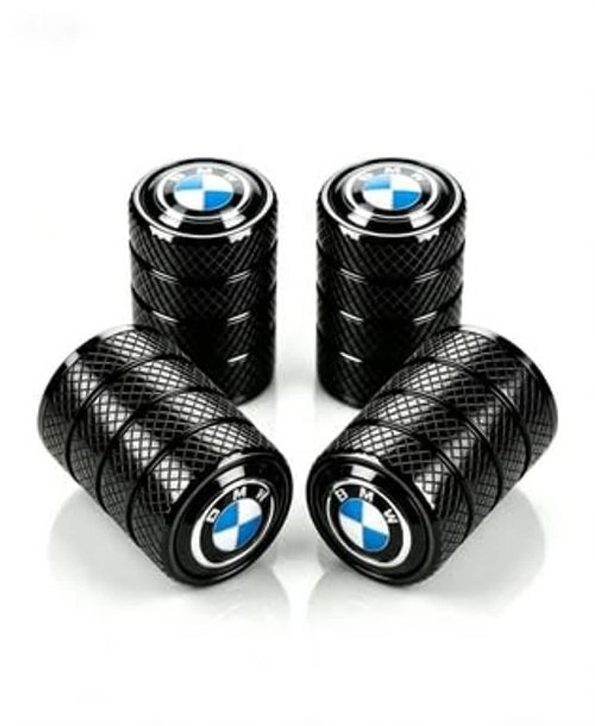 Tire valve stem caps set: four black caps with BMW logo, two laid in front