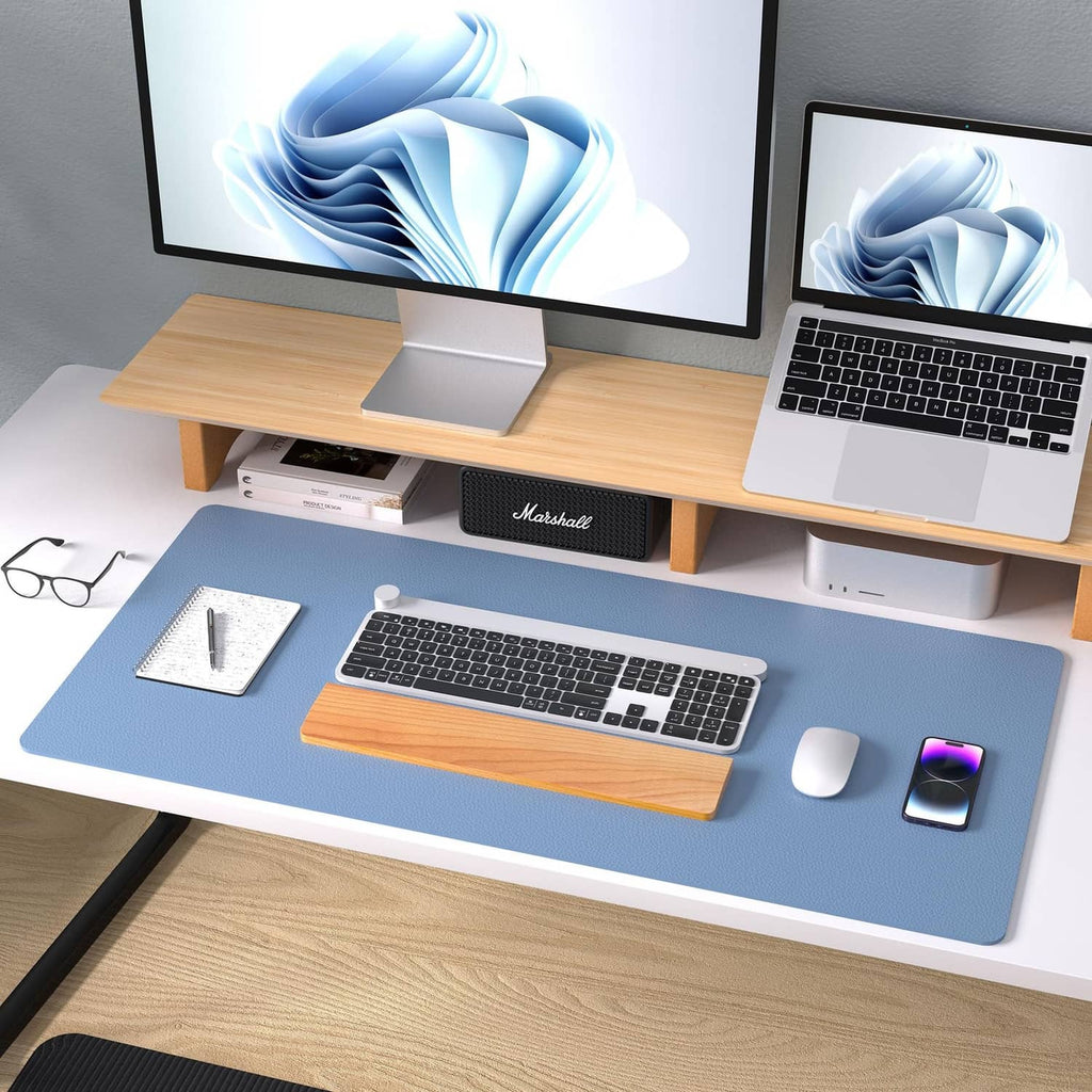 Denim blue desk pad protector on office table with keyboard and mouse