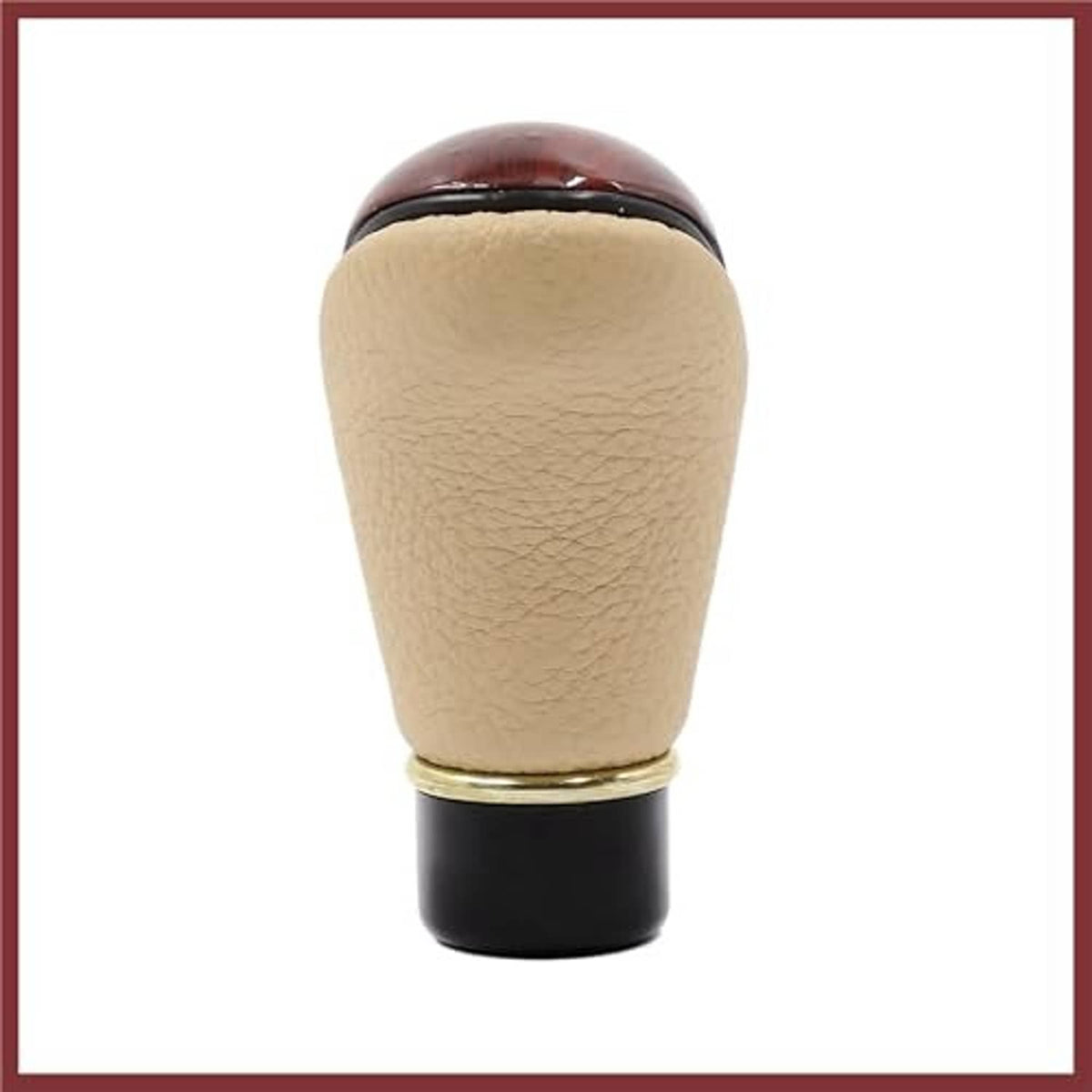 Beige faux leather gear shift knob with gold ring and black mounting base