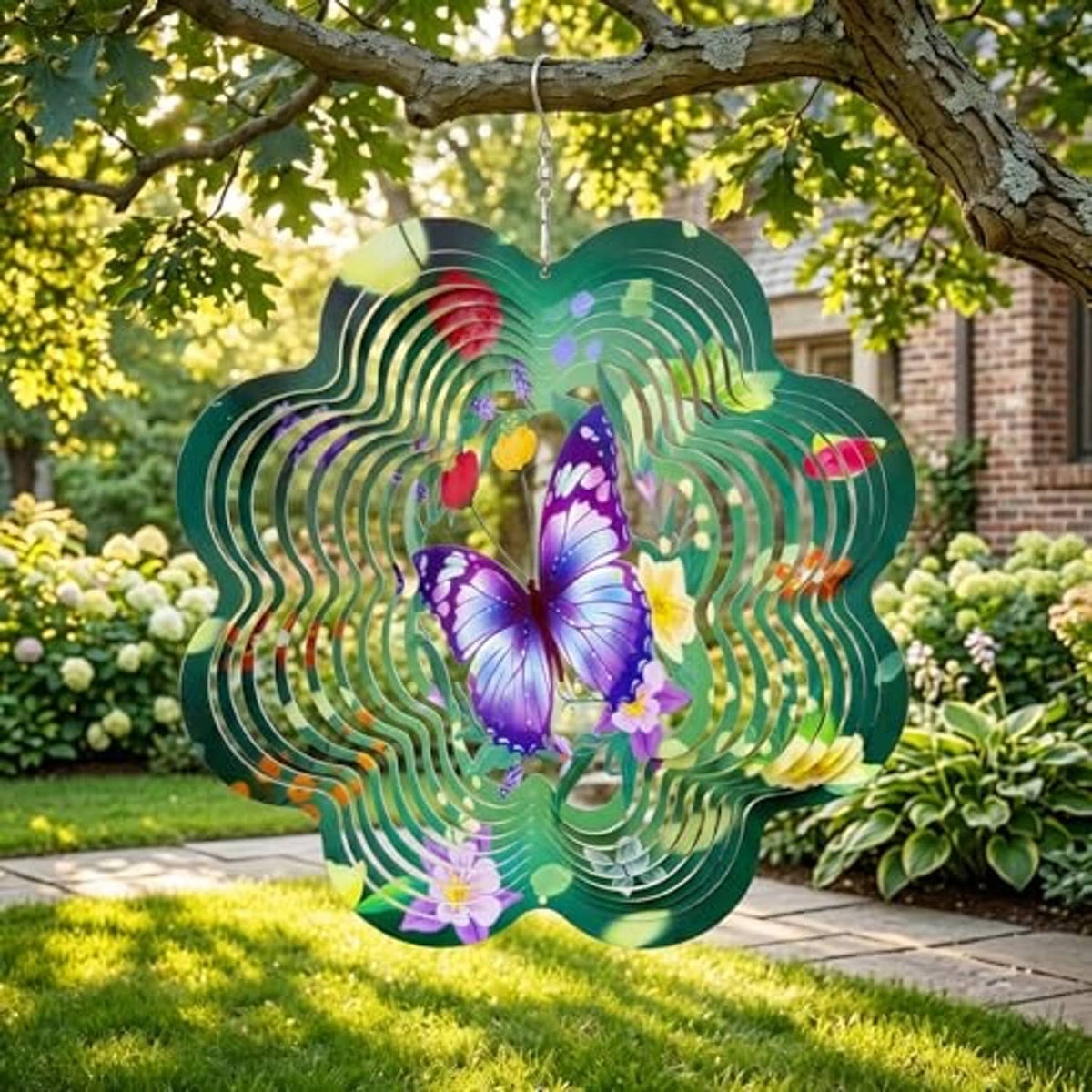 Green butterfly wind spinner outdoors with purple butterfly center and rainbow rings