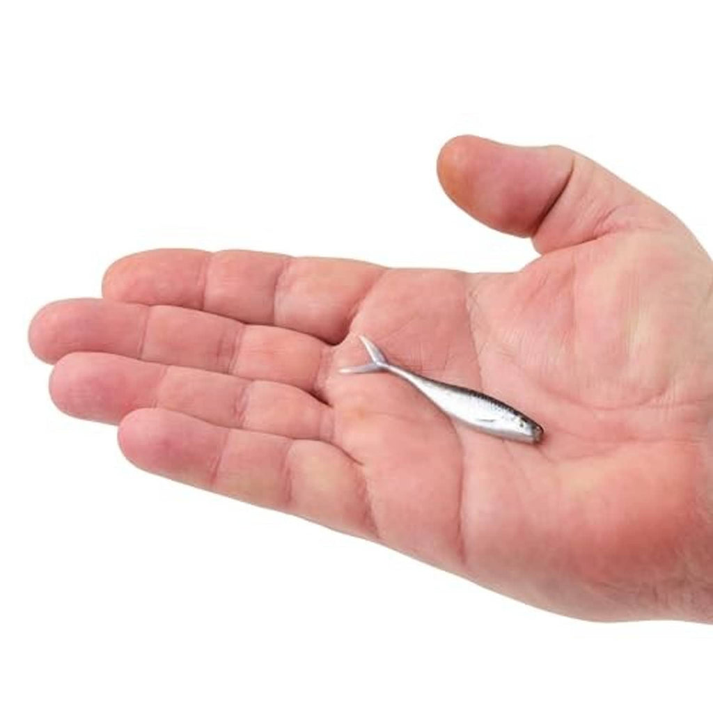 Small silver minnow soft lure on a hand, metal hook attached