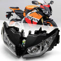 Front headlight assembly pair with black housings and clear lenses, mounted on sport bike.