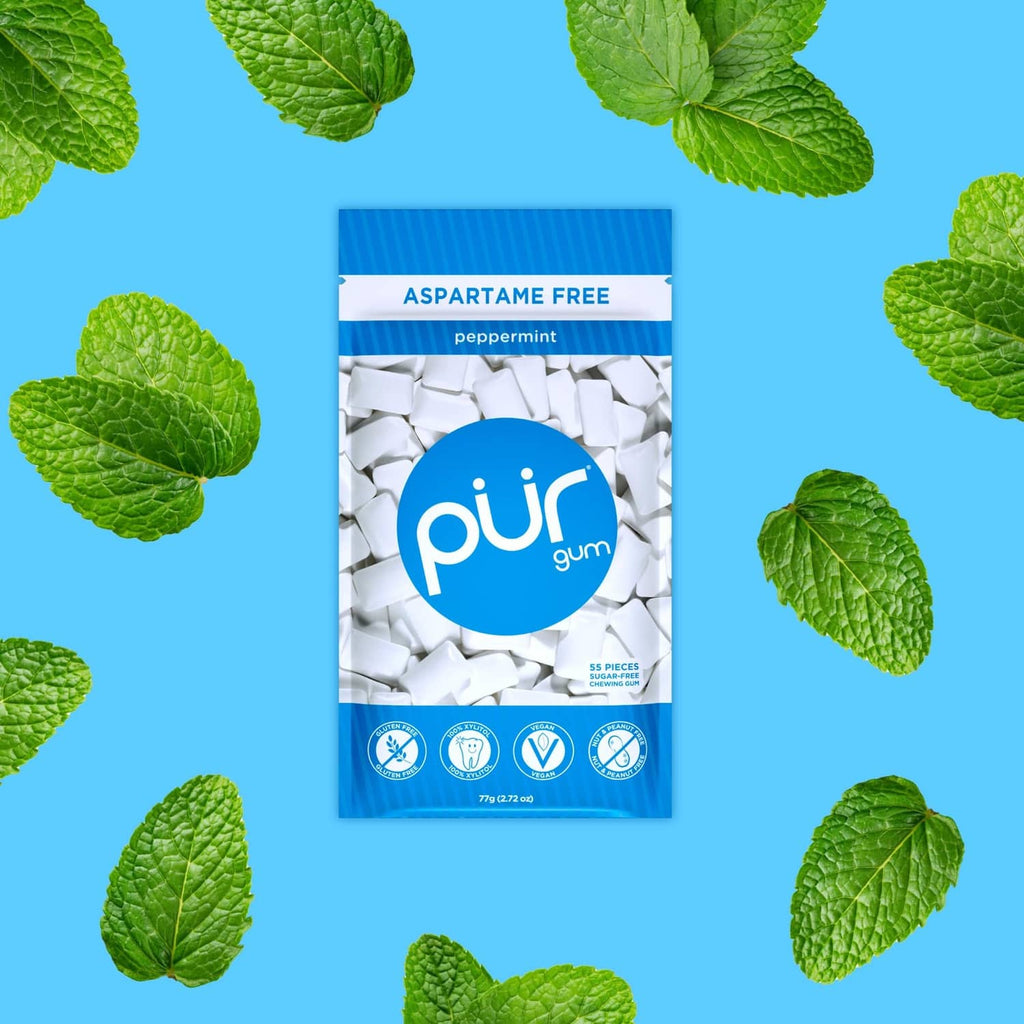 Peppermint gum pouch marked Aspartame Free with white gum pieces inside