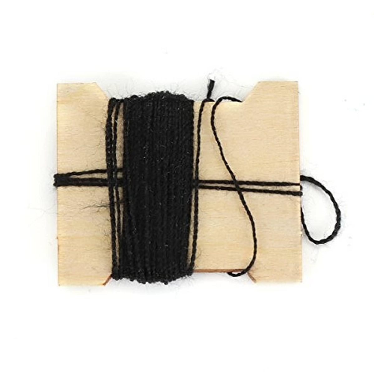 Small bundle of black braided cord wrapped on light wooden backing