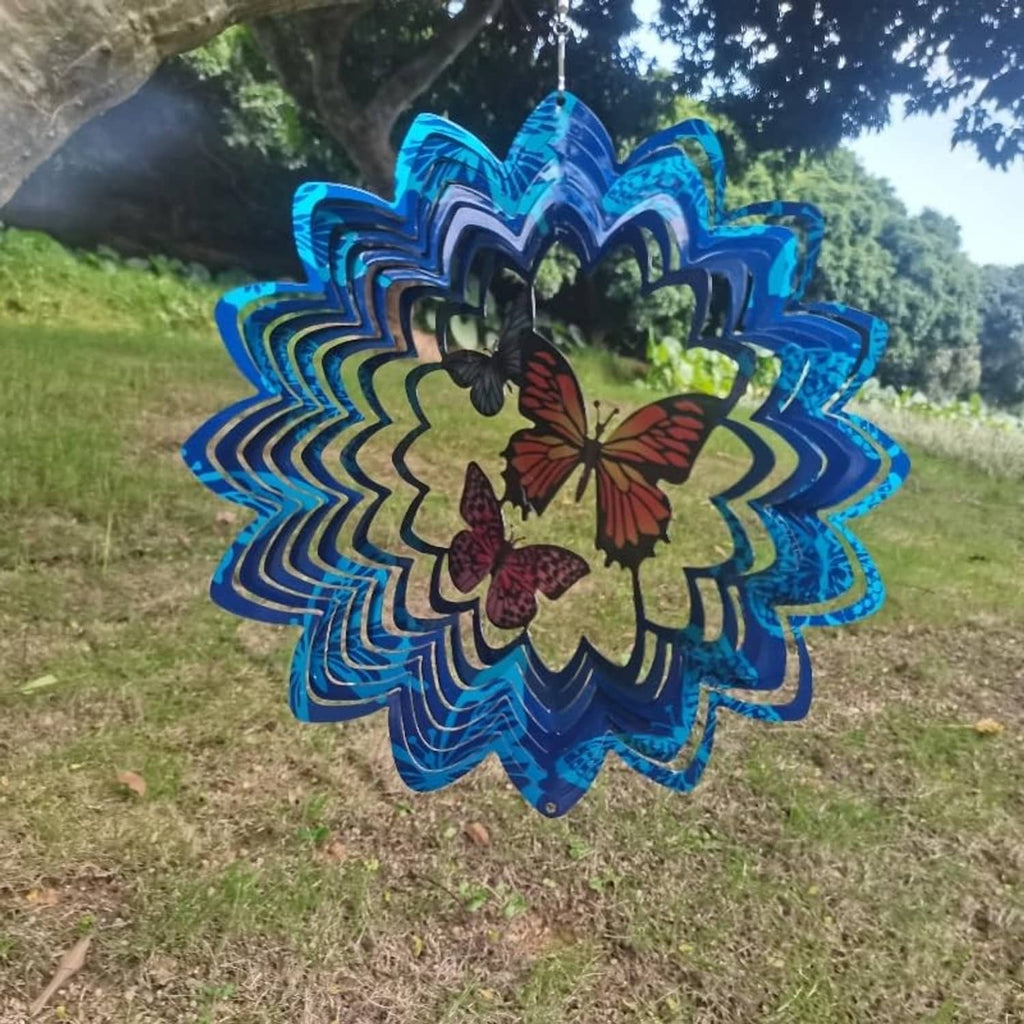 Blue metal wind spinner with butterfly accents, circular layered pattern and hanging chain