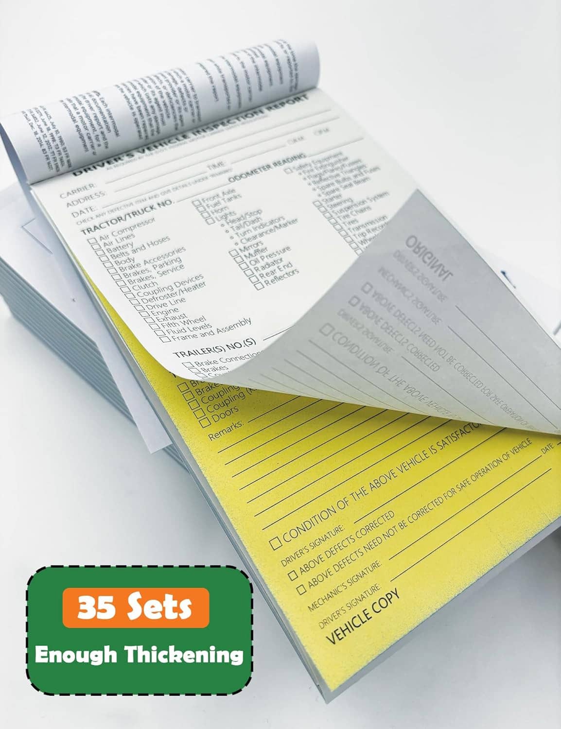 Pack of vehicle inspection report forms with yellow copy sheet and stacked pages