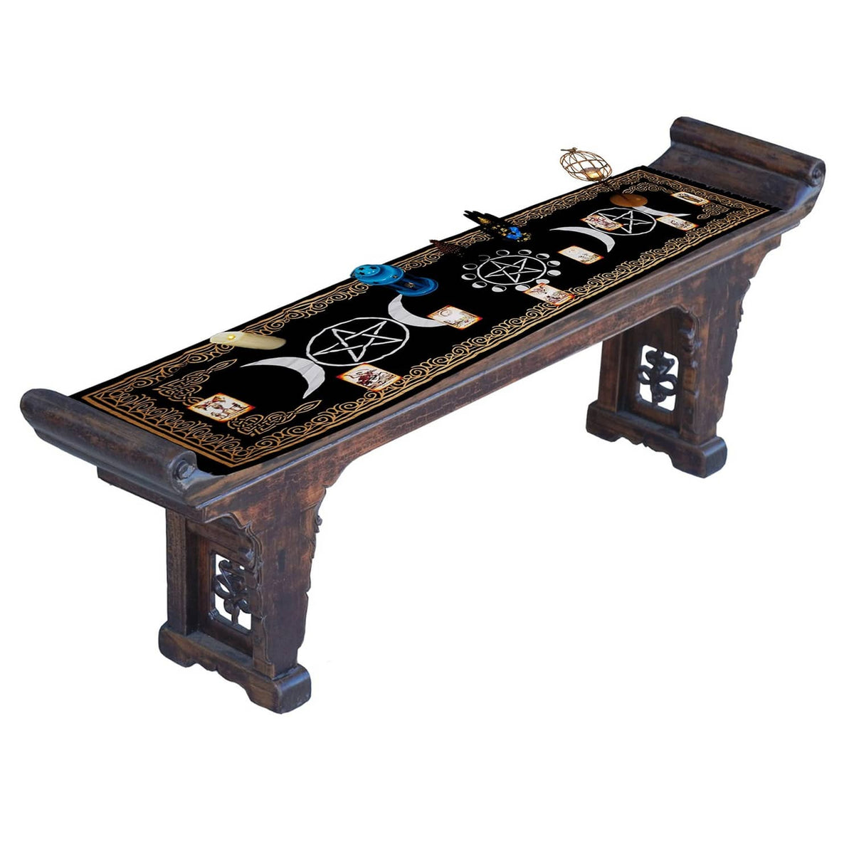 Black altar cloth with gold trim and moon/pentagram symbols on long bench