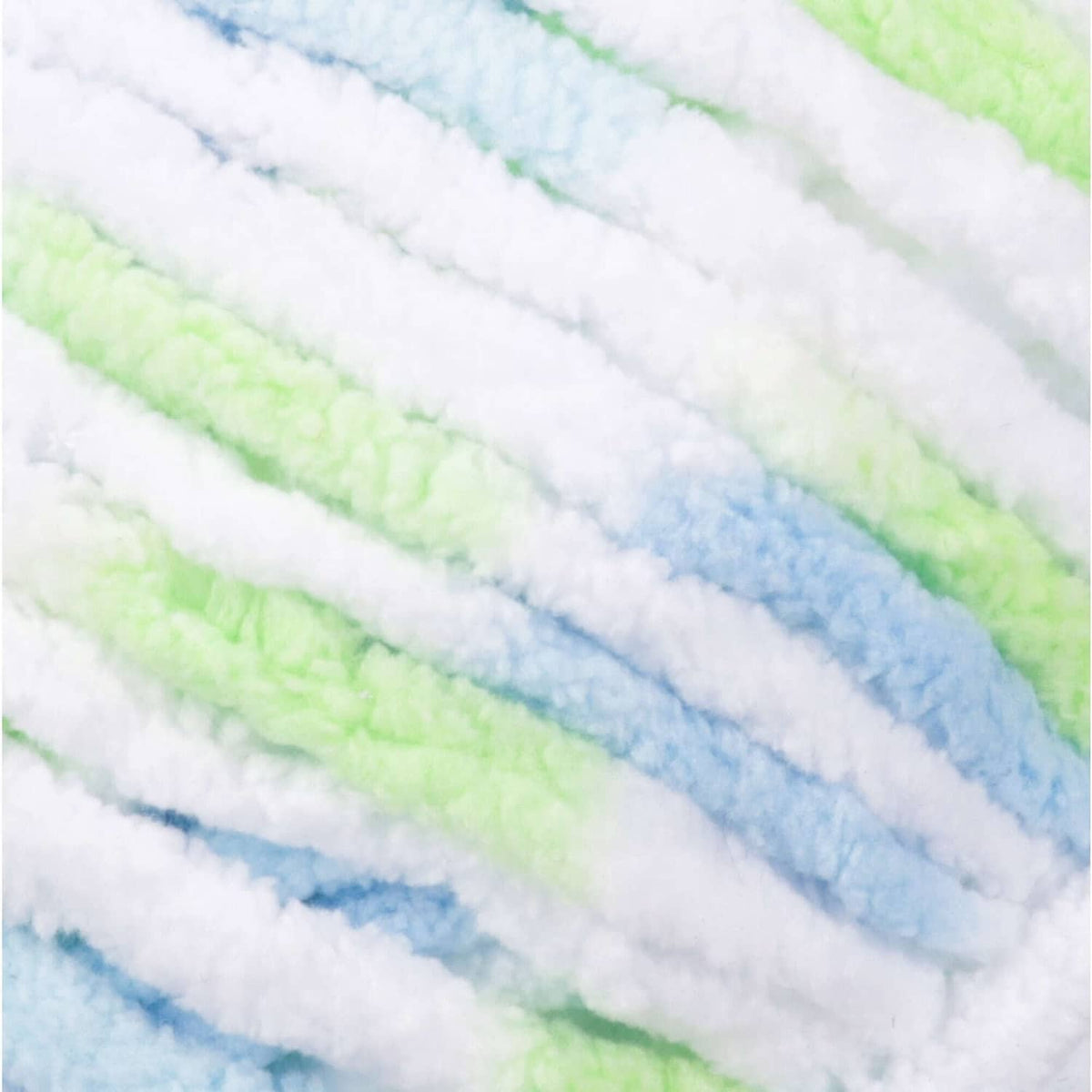 Close-up of pastel super bulky yarn stripes in white, light blue, and pale green bands