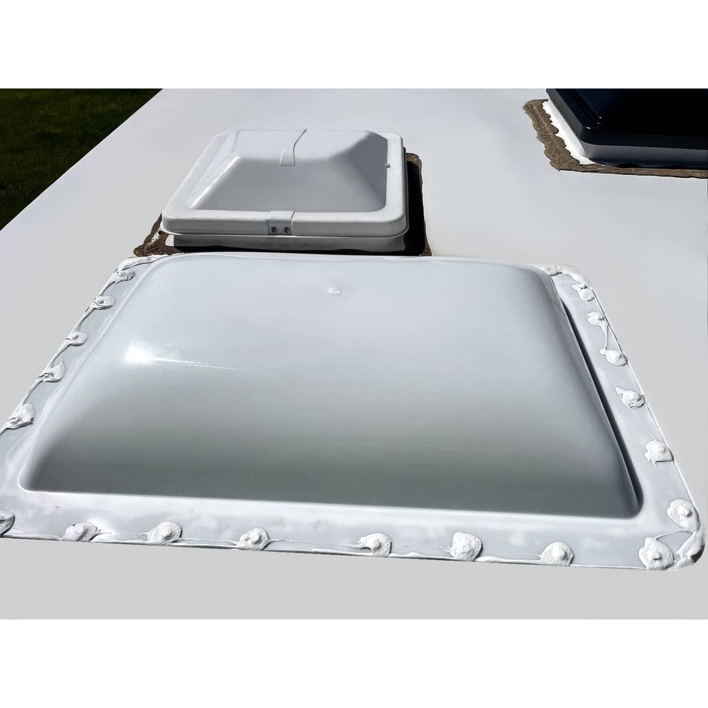 White RV skylight cover, 18 x 26 in, with corner clips and mounting screws