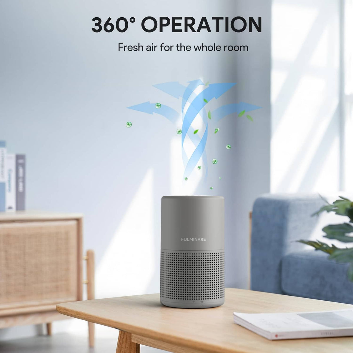Gray FULMINARE air purifier centered on table, top fan and front vent panel
