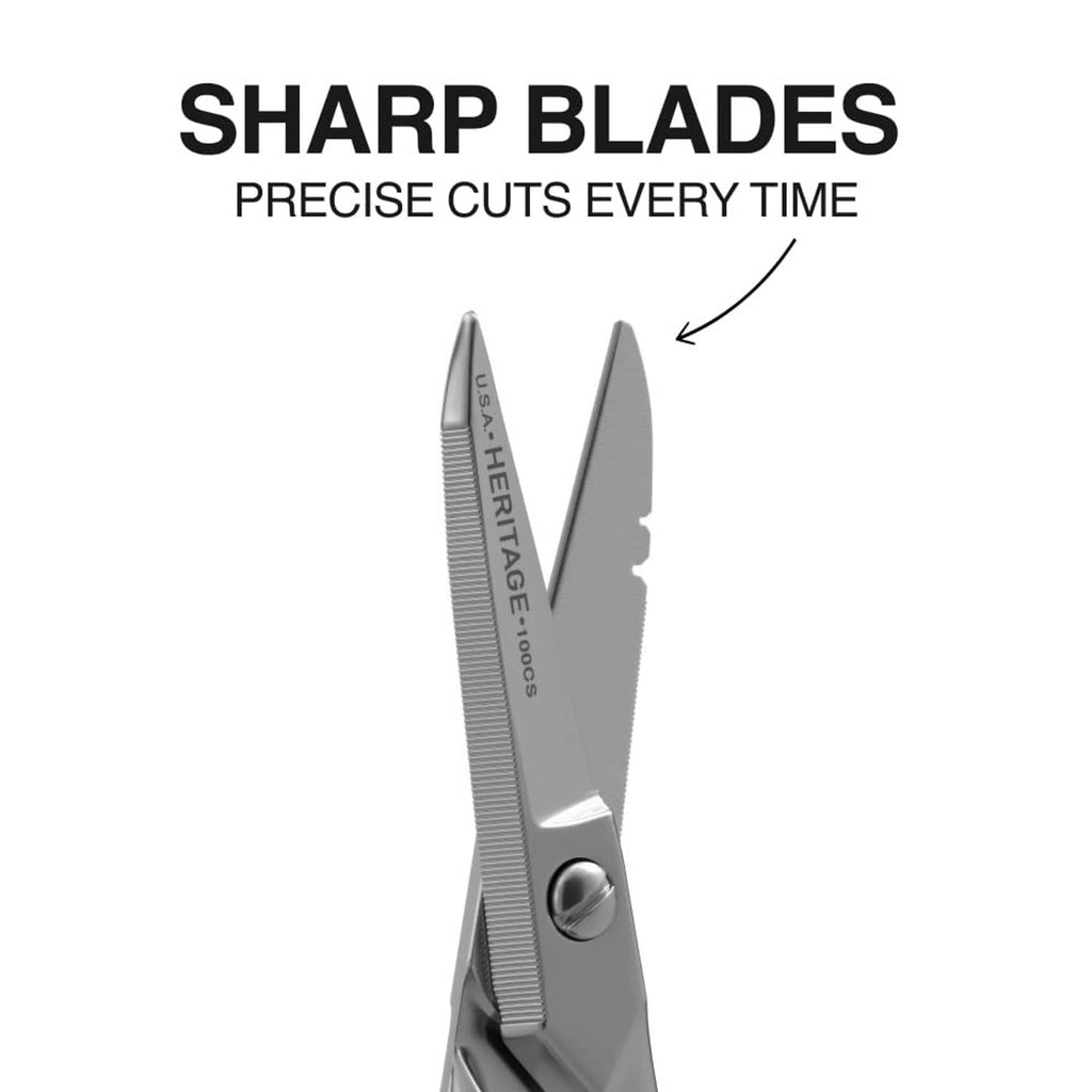 Precision scissors side view with long blades and engraved markings on the metal