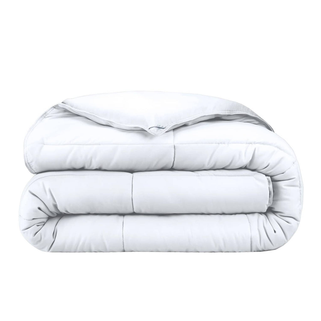 White down-alternative king comforter, neatly folded with quilted baffle stitching