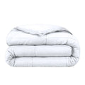 White down-alternative king comforter, neatly folded with quilted baffle stitching