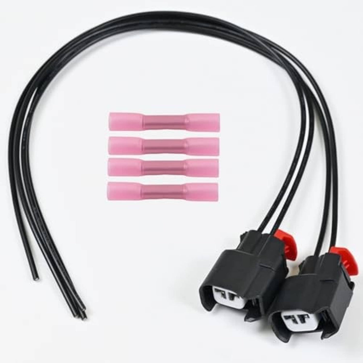 ABS wheel speed sensor connector pair with black wire leads and pink heat-shrink sleeves