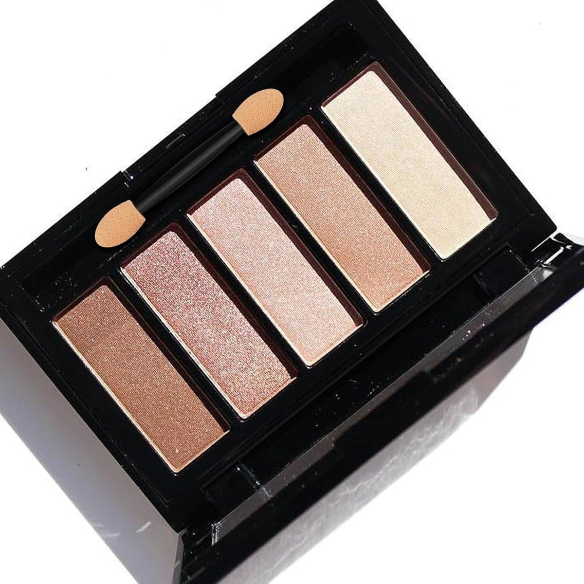 Dual-tip sponge eyeshadow brushes with black handles, shown over an open multi-shade palette