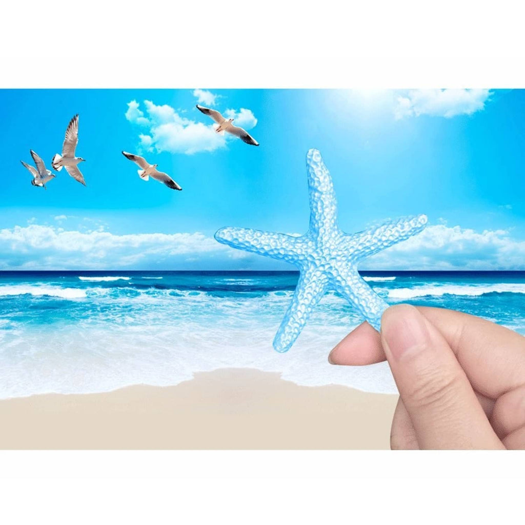 Light blue starfish ornament being held in hand, beach-themed placement