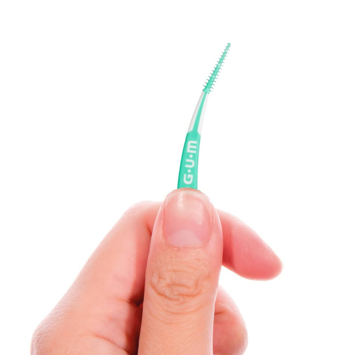 Teal dental pick held in hand, soft bristles for teeth cleaning