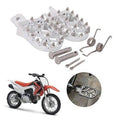 Silver dirt bike foot pegs with traction pins and installation hardware